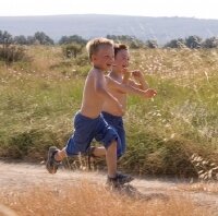 Two boys running outside with glee... photo credit: freedigitalphotos.net